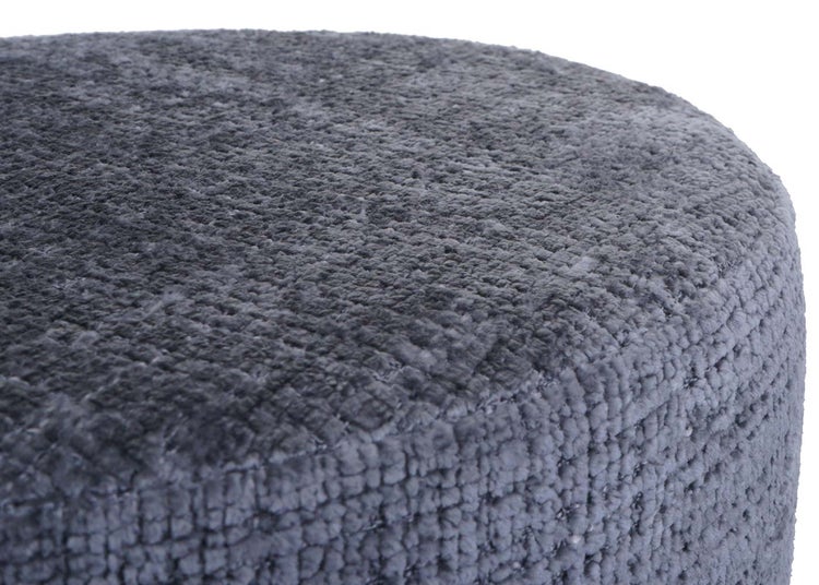 Detailansicht eines grauen Poufs mit Textur
