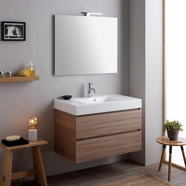 Modernes Badezimmer mit Waschtisch, Spiegel und Beleuchtung für ein stilvolles Ambiente