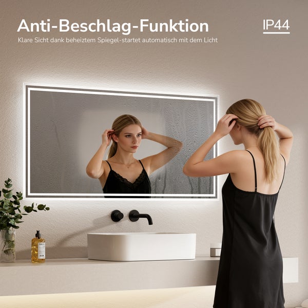 Beleuchteter Badezimmerspiegel mit Anti-Beschlag-Funktion durch Heizung und Schutzart IP44. Modernes Bad mit Aufsatzwaschbecken und Wandarmatur.