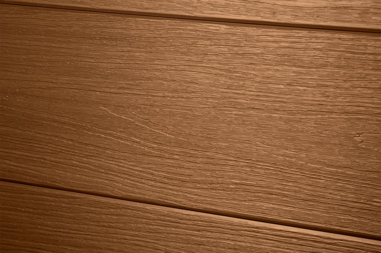 Fassadenpaneele mit geprägter Holzstruktur in der Detailansicht.