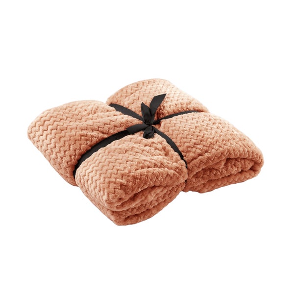 Gefaltete Kuscheldecke mit Band