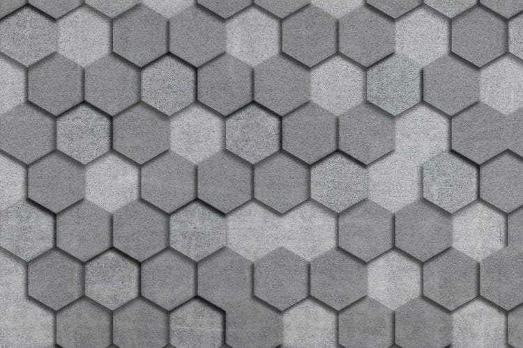 Wandfliesen in hexagonaler Form mit strukturierter Betonoptik fuer eine moderne Innenwandgestaltung.