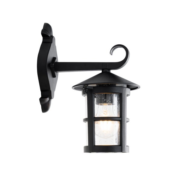 Schwarze Außenwandleuchte im klassischen Laternendesign mit klarem Glas und dekorativer Wandhalterung.