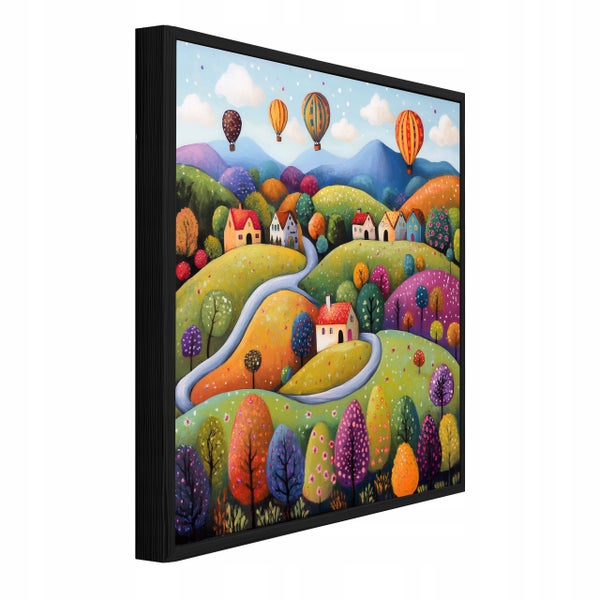 Wandbild in schwarzem Rahmen mit einer bunten Landschaftsdarstellung von Hügeln, kleinen Häusern und Heißluftballons im Hintergrund.