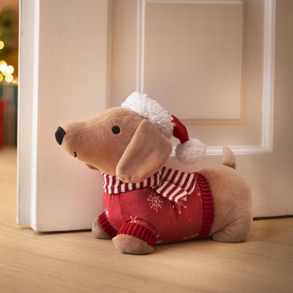 Dackel Türstopper aus Plüsch mit weihnachtlichem Pullover und Mütze als Dekofigur für die Inneneinrichtung.