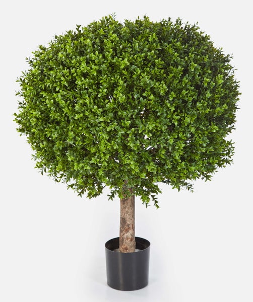 Künstliche Buchsbaumhecke mit dichten grünen Blättern aus Kunststoff in der Nahaufnahme.