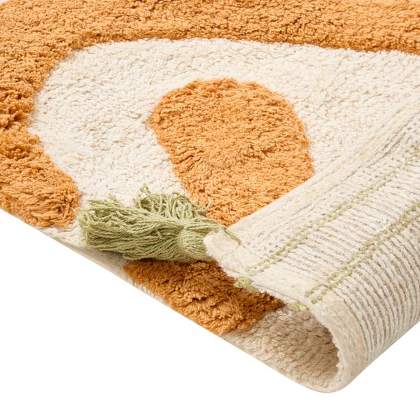 Flauschiger Badteppich mit strukturiertem Muster und Quaste in einer Ecke
