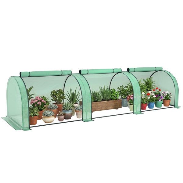 Langes Pflanztunnel Gewächshaus mit Netzabdeckung für den Garten, gefüllt mit verschiedenen Topfpflanzen und Kräutern.