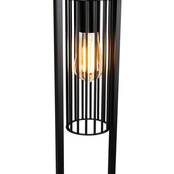 Schwarze Stehlampe mit Gitter und Glühbirne