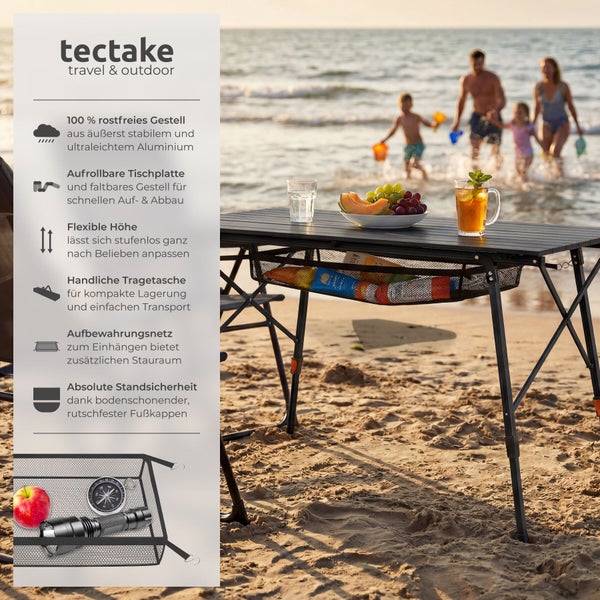 Tectake Aluminium-Campingtisch mit aufrollbarer Platte, höhenverstellbaren Beinen und Netzablage auf hellem Sandstrand mit Meereswellen.