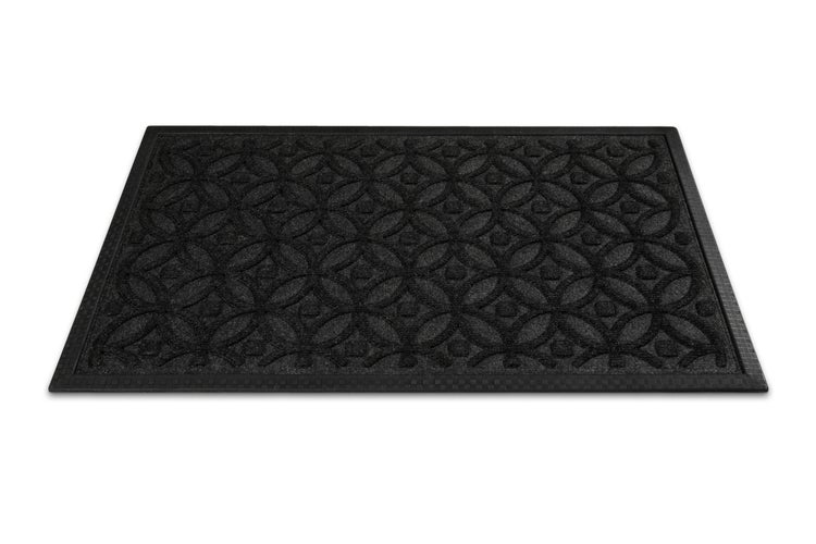 Schwarze rechteckige Fußmatte aus Gummi mit geometrischem Kreismuster.