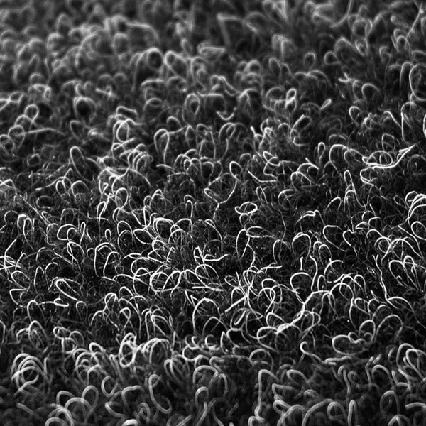 Nahaufnahme einer strukturierten Oberfläche mit vielen kleinen Schlaufen.
