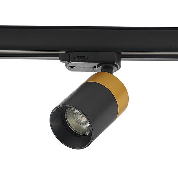Schwarzer und goldfarbener zylindrischer Strahler für Schienensysteme, verstellbarer Kopf, an einer schwarzen Schiene befestigt.