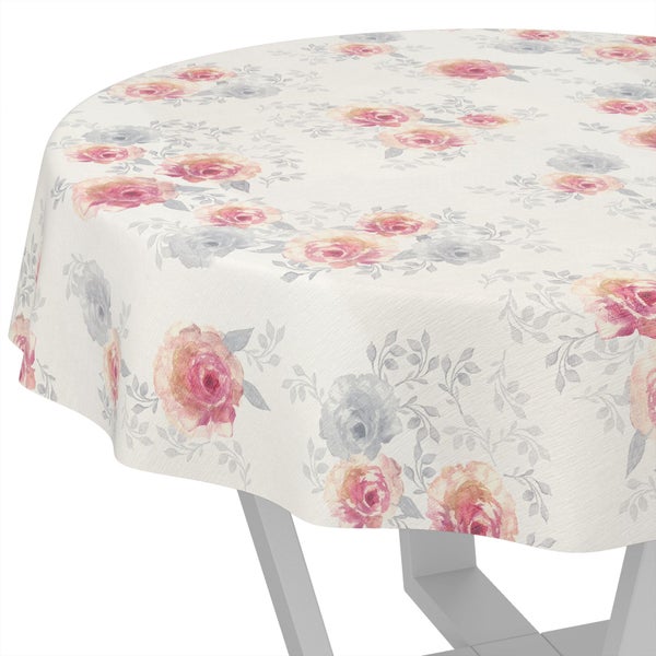 Rundes, weißes Tischtuch mit einem floralen Muster aus rosa Rosen und grauen Blättern.