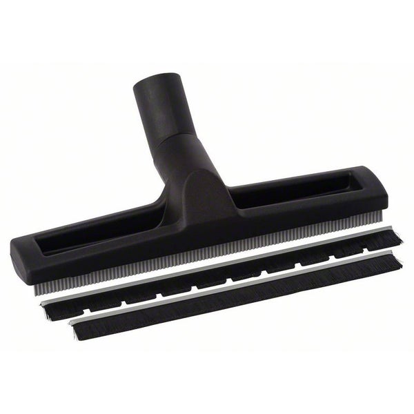 Vertikale Bandschleifmaschine mit Elektromotor, grauem Metallgehäuse, grünem Schleifband und Not-Aus-Schalter.