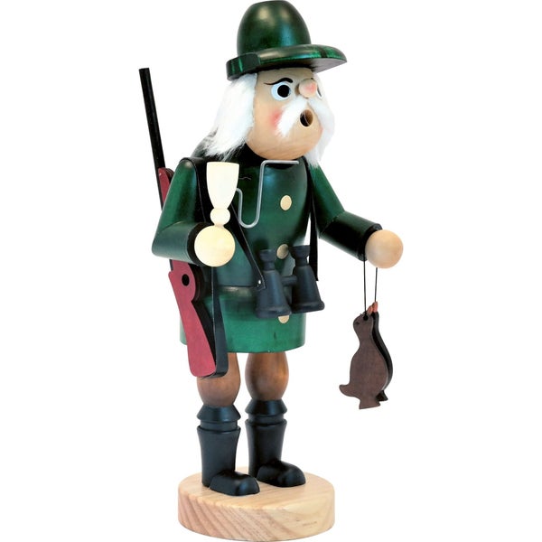 Nussknacker in Form eines Jägers aus Holz mit Hut Fernglas Gewehr und erlegtem Wild als dekorative Weihnachtsfigur