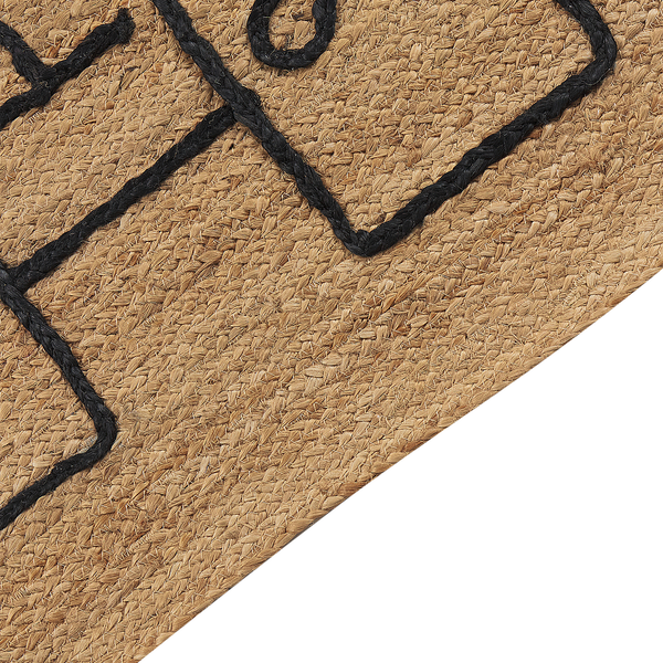 Detailaufnahme eines Teppichs aus Naturfaser Jute mit geflochtenem schwarzem Design.
