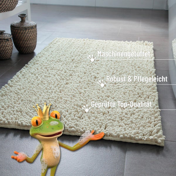 Cremefarbener, maschinengetufteter Badteppich mit Noppenstruktur in einem Badezimmer, robust und pflegeleicht, geprüfte Qualität.
