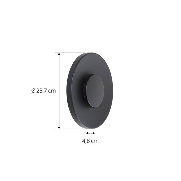 Schwarze runde Rosette mit einem Durchmesser von 23,7 Zentimetern und einer Tiefe von 4,8 Zentimetern.
