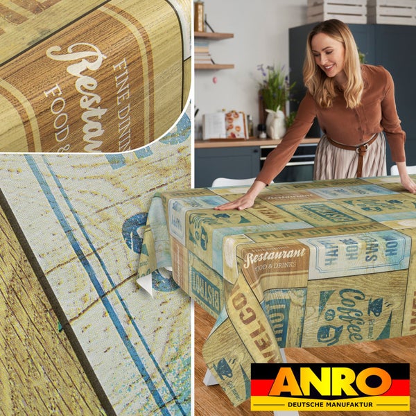 Abwaschbare ANRO Tischdecke mit Vintage-Holzoptik und Restaurant-Motiven auf einem Küchentisch, Detailansicht des Materials, ANRO Logo.