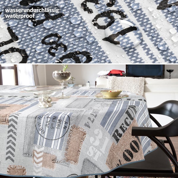 Wasserundurchlässige Tischdecke mit grafischem Muster auf einem gedeckten Tisch