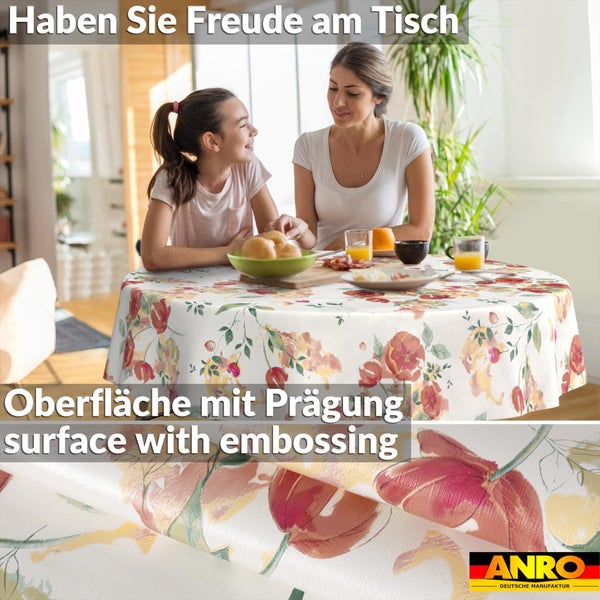 Runde Tischdecke mit floralem Muster und geprägter Oberfläche in einer Wohnszene beim Frühstück. ANRO Logo.