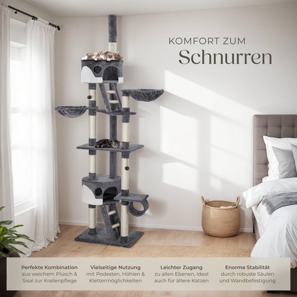 Katzenkratzbaum mit Plattformen, Höhlen und Sisalstämmen im Wohnzimmer mit zwei Katzen