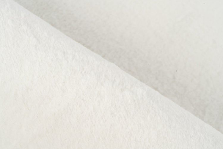 Strukturaufnahme von flauschigem Textilstoff mit weicher Oberflächenbeschaffenheit