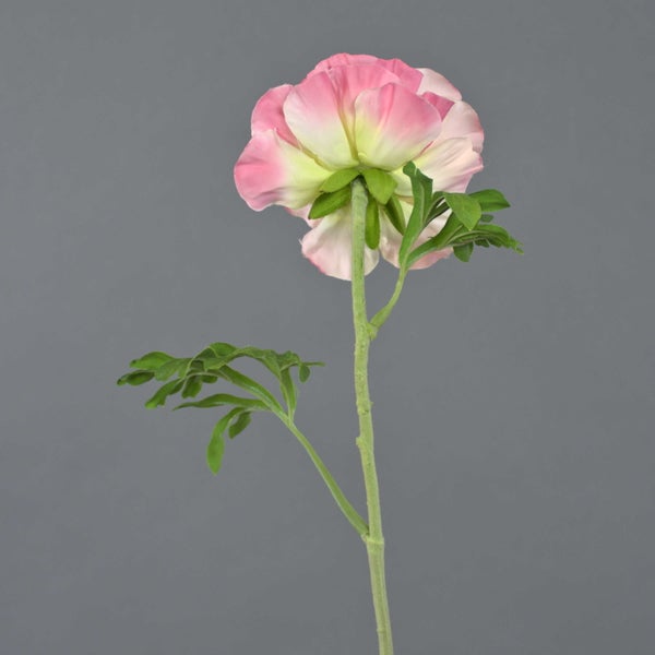 Künstliche Pfingstrose aus Textilmaterial in Rosa und Creme mit grünem Stiel.