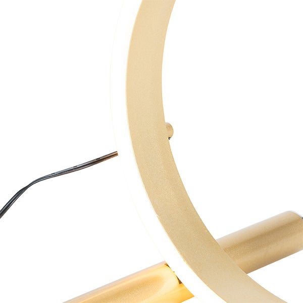 Detailaufnahme einer goldenen LED-Lampe mit kreisförmigem Design.