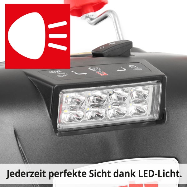Nahaufnahme einer Schneefräse mit LED-Licht und Scheinwerfer-Symbol.