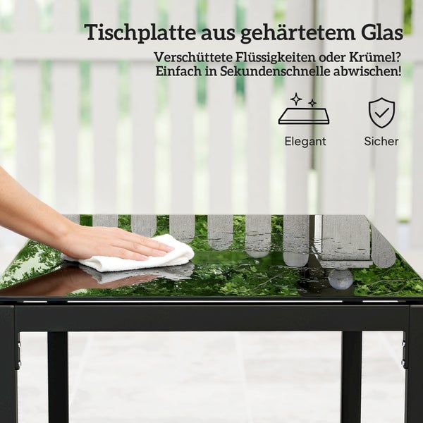 Tischplatte aus gehärtetem Glas wird mit einem Tuch abgewischt. Symbole für elegant und sicher.