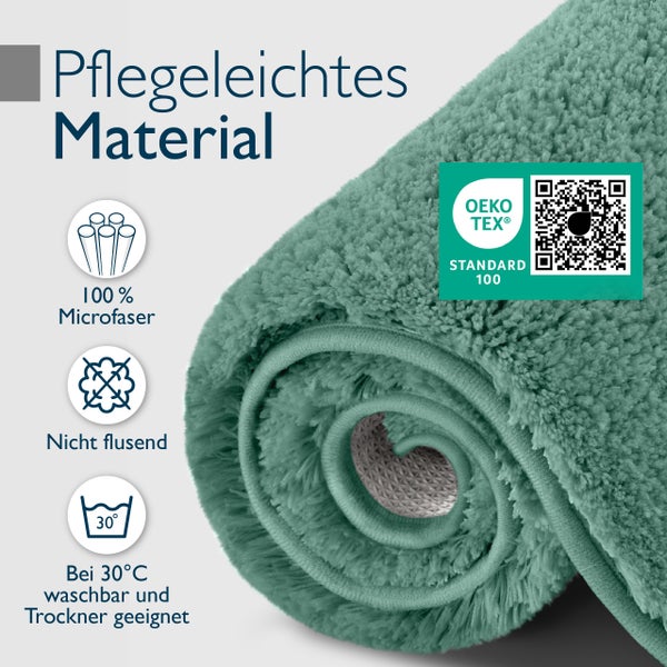 Aufgerollter Badteppich aus pflegeleichter Mikrofaser mit Oeko Tex Standard 100 Zertifizierung, fusselarm und bei 30 Grad waschbar.