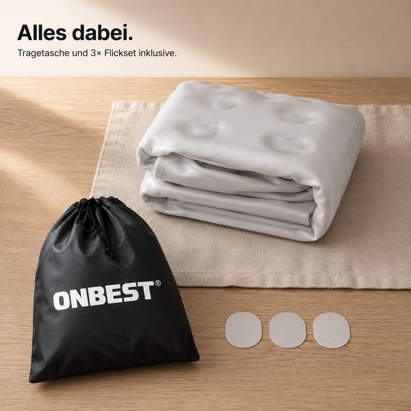 Zusammengefaltete Luftmatratze inklusive Tragetasche mit ONBEST Logo und drei Reparaturflicken.
