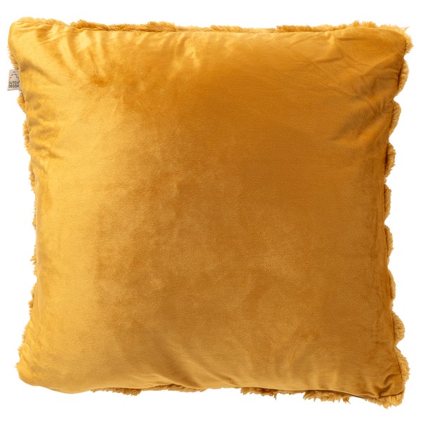 Quadratisches senfgelbes Samtkissen mit Fransensaum und Dutch Decor Logo.