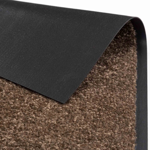 Detailansicht einer Fußmatte mit textiler Oberfläche und Rückseite aus Gummi