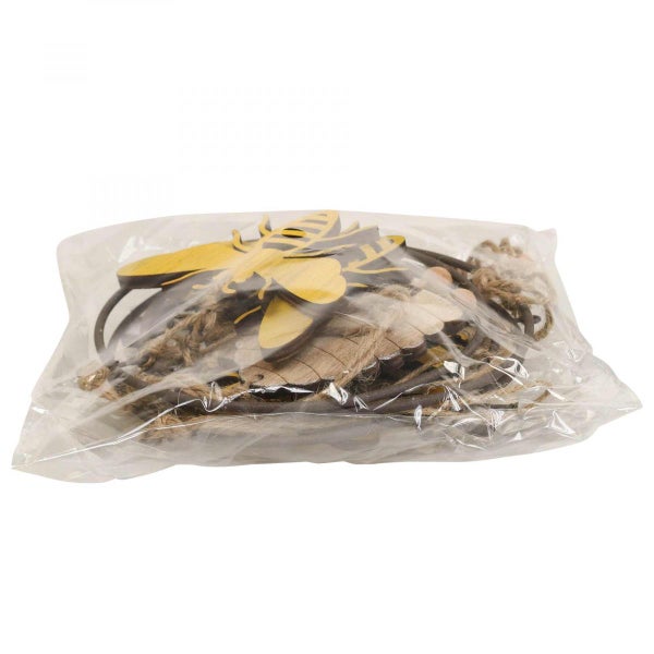 Dekoratives Set mit Holzmotiven Biene, Blätter und Schnur in Verpackung.