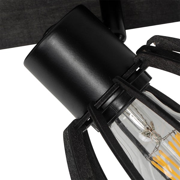 Detailaufnahme einer Deckenleuchte mit schwarzem Lampenkopf und Glühbirne