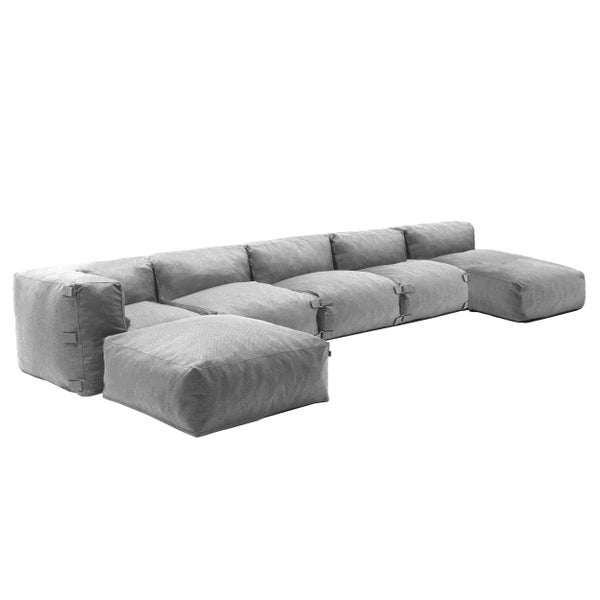 Modulares Lounge-Sofa in Grau, U-Form, gepolsterte Segmente für Garten und Terrasse.