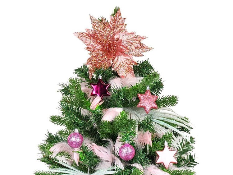 Weihnachtsbaumspitze in Sternform mit glitzernden Weihnachtskugeln und Federn an einem Tannenbaum