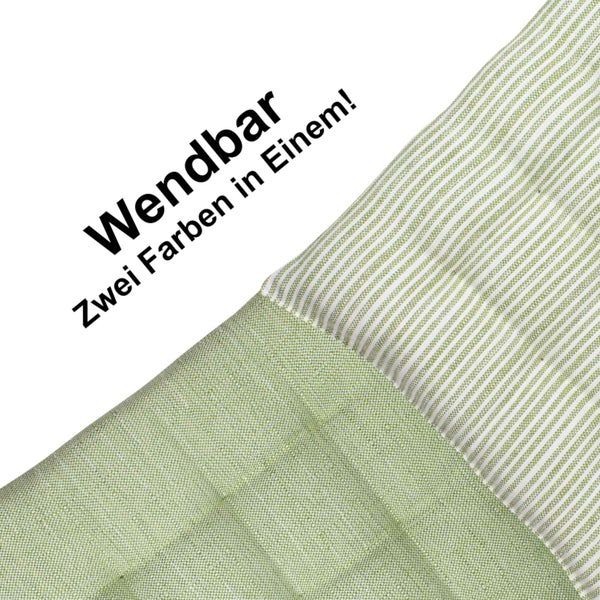 Wendbares Sitzkissen mit zwei verschiedenen Designs: eine Seite strukturiert, eine Seite gestreift.