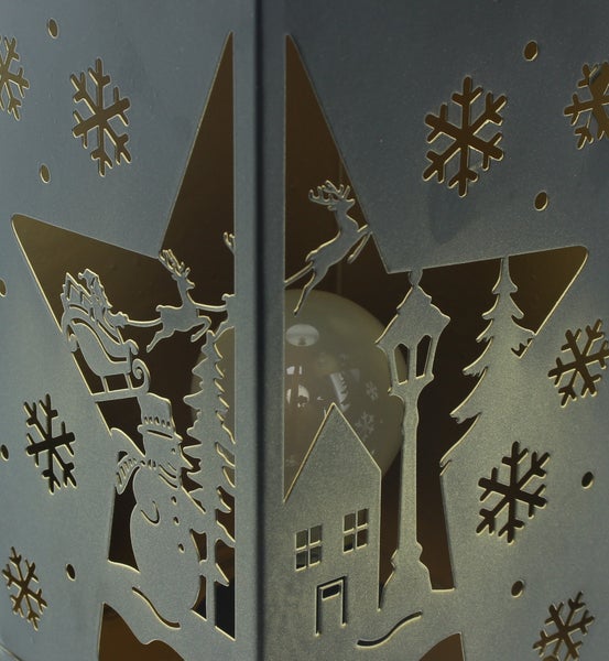 Dekorative Laterne mit weihnachtlichen Ausschnitten wie Schneeflocken, Weihnachtsmann mit Rentieren, Schneemann und Häusern.