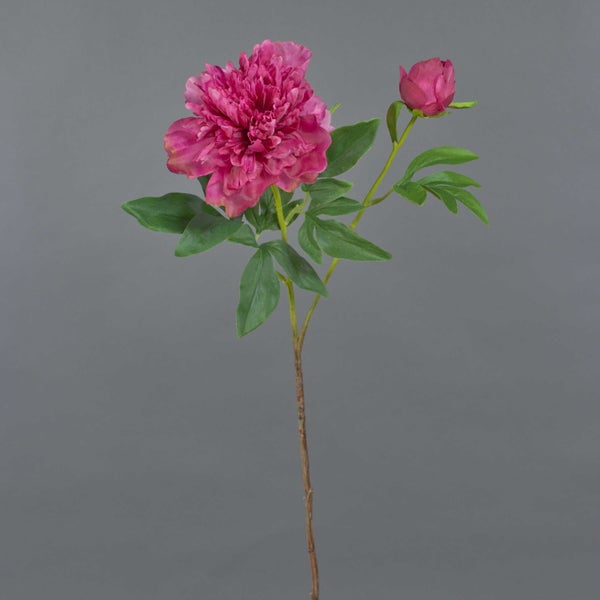 Künstliche rosa Pfingstrose mit einer Blüte, einer Knospe und grünen Blättern am Stiel.