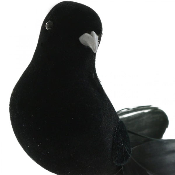 Dekorative schwarze Vogel-Figur mit hellem Schnabel