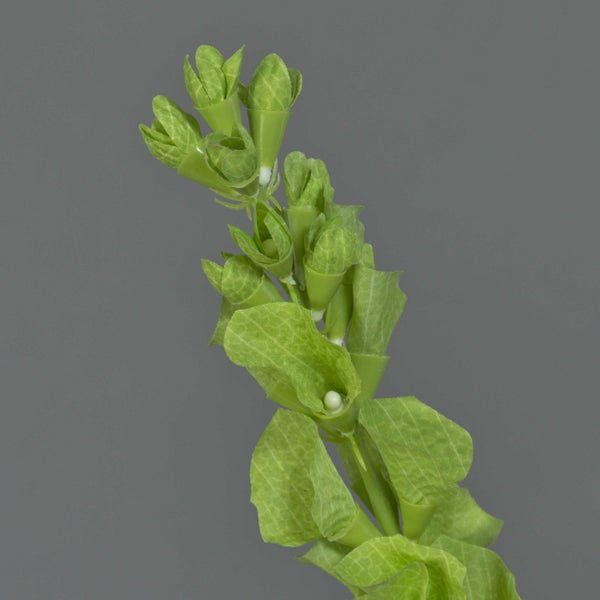 Künstlicher Hibiskuszweig mit rosa Blüten und grünen Blättern