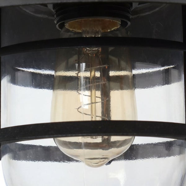 Nahaufnahme einer Lampe mit Glühbirne und Schutzgitter