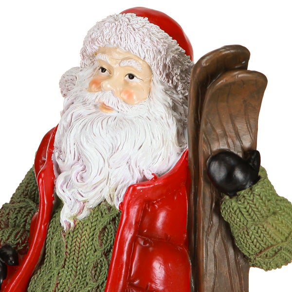 Weihnachtsmann-Figur mit Skiern