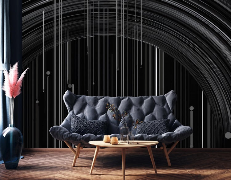 Wohnzimmer mit grauer Couch, Holztisch und abstrakter Wandgestaltung für ein modernes Ambiente