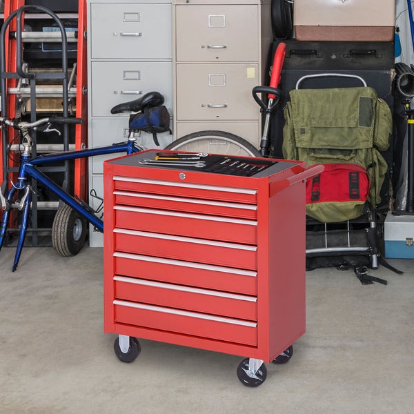 Mobiler Werkstattwagen aus Metall mit sieben Schubladen und Werkzeugablage oben, platziert in einer Garage mit Fahrrad und Aktenschränken.