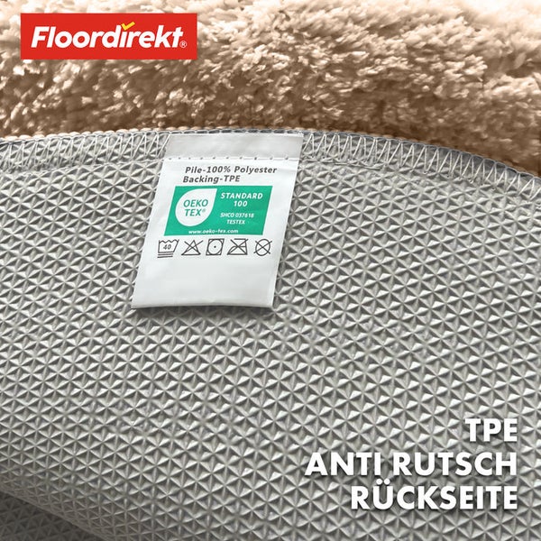 Rückseite eines Teppichs mit Anti-Rutsch-Beschichtung und Öko-Tex Standard 100 Siegel.